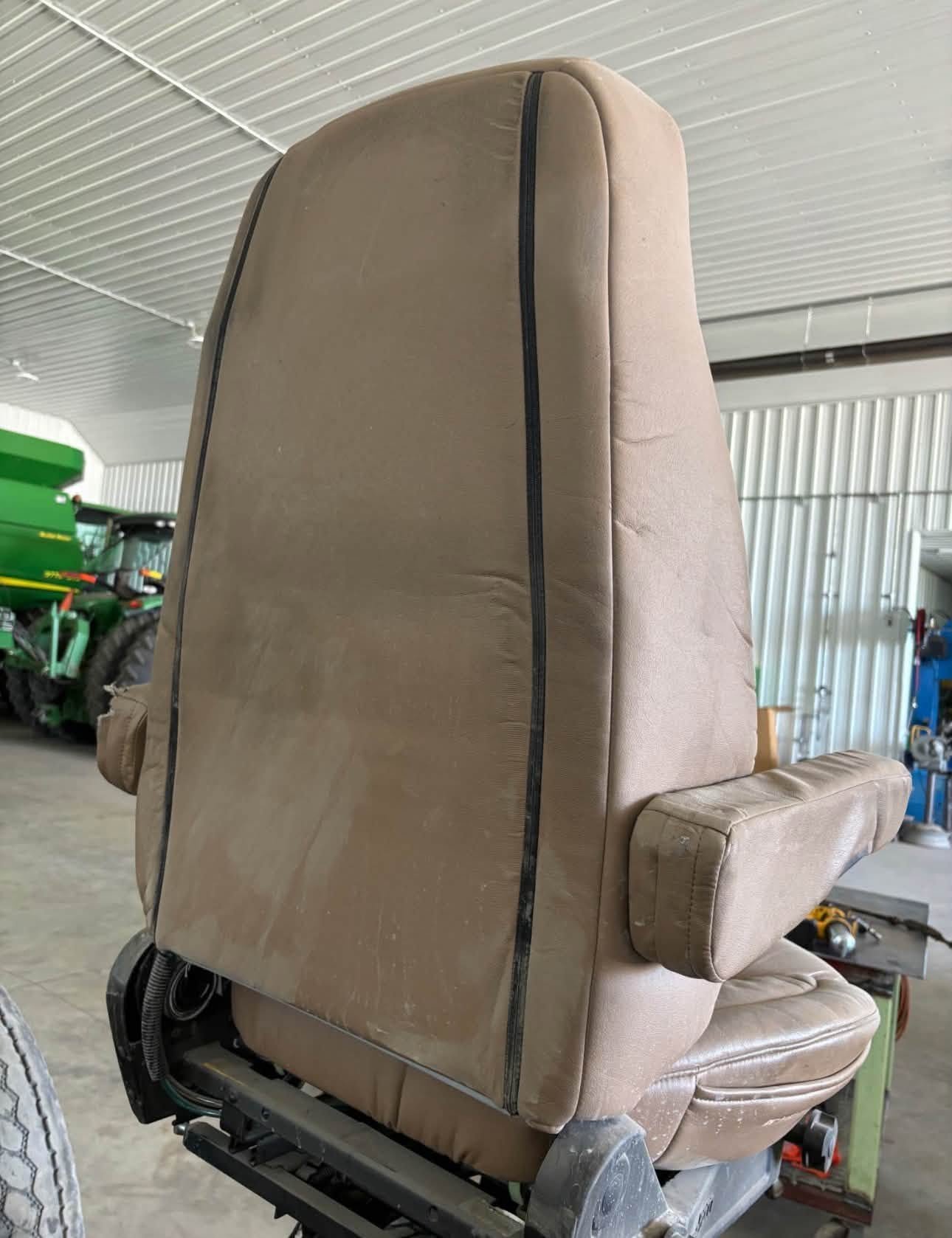 Bostrom Wide Ride seat, Bostrom air ride seat, Bostrom truck seat, Bostrom Wide Ride air seat, tan leather truck seat, truck air ride seat, used Bostrom seat, Bostrom seat for sale, used truck seat, replacement truck seat, semi truck air ride seat, heavy duty truck seat, commercial truck seat, Bostrom Wide Ride replacement seat, tan truck seat, air suspension truck seat.