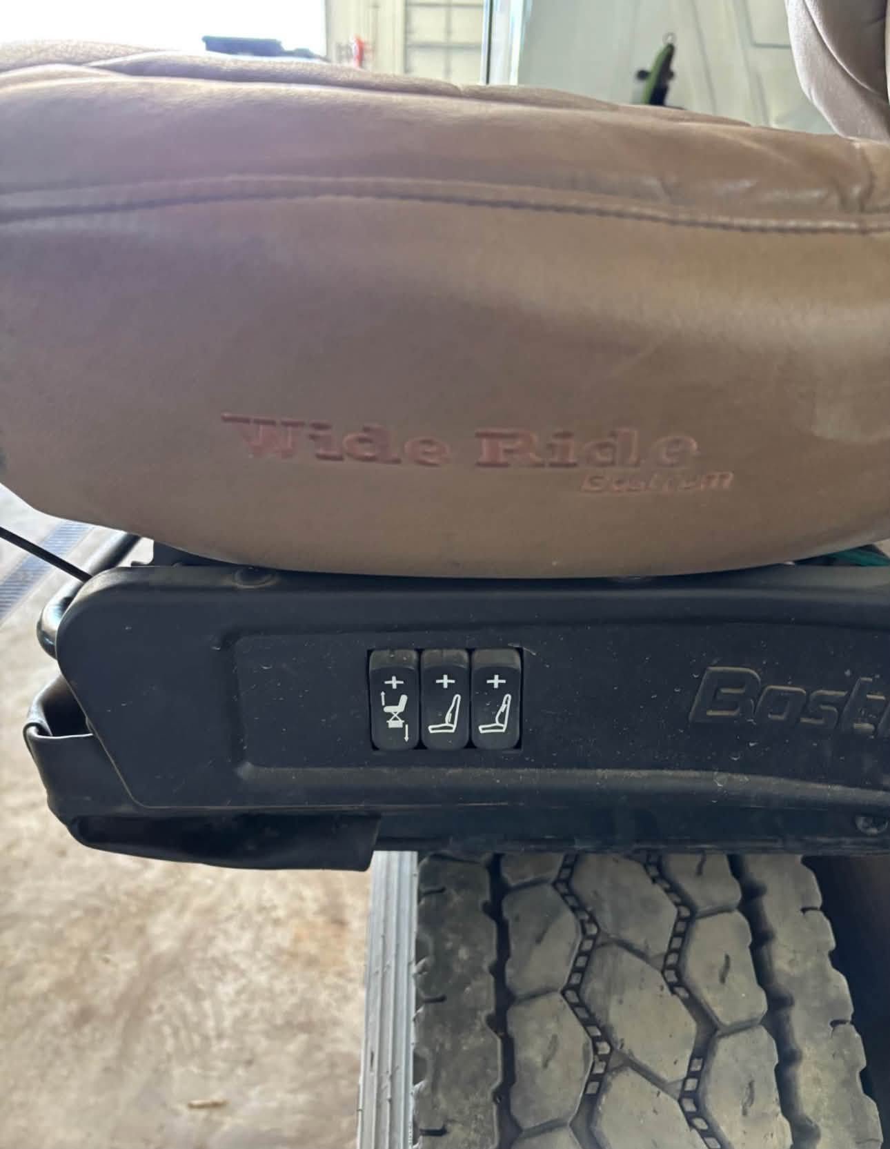 Bostrom Wide Ride seat, Bostrom air ride seat, Bostrom truck seat, Bostrom Wide Ride air seat, tan leather truck seat, truck air ride seat, used Bostrom seat, Bostrom seat for sale, used truck seat, replacement truck seat, semi truck air ride seat, heavy duty truck seat, commercial truck seat, Bostrom Wide Ride replacement seat, tan truck seat, air suspension truck seat.