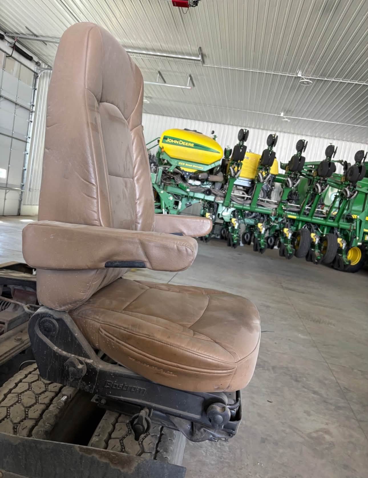 Bostrom Wide Ride seat, Bostrom air ride seat, Bostrom truck seat, Bostrom Wide Ride air seat, tan leather truck seat, truck air ride seat, used Bostrom seat, Bostrom seat for sale, used truck seat, replacement truck seat, semi truck air ride seat, heavy duty truck seat, commercial truck seat, Bostrom Wide Ride replacement seat, tan truck seat, air suspension truck seat.