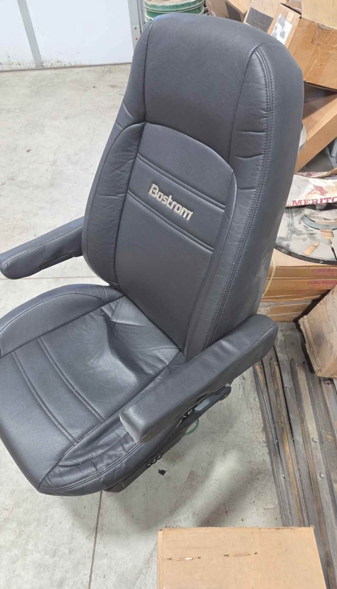 Bostrom black air ride seat, Bostrom truck seat, used air ride truck seat, black semi truck seat, air suspension truck seat, heavy duty truck seat, replacement truck seat, semi truck interior parts, used Bostrom seat, commercial truck seat