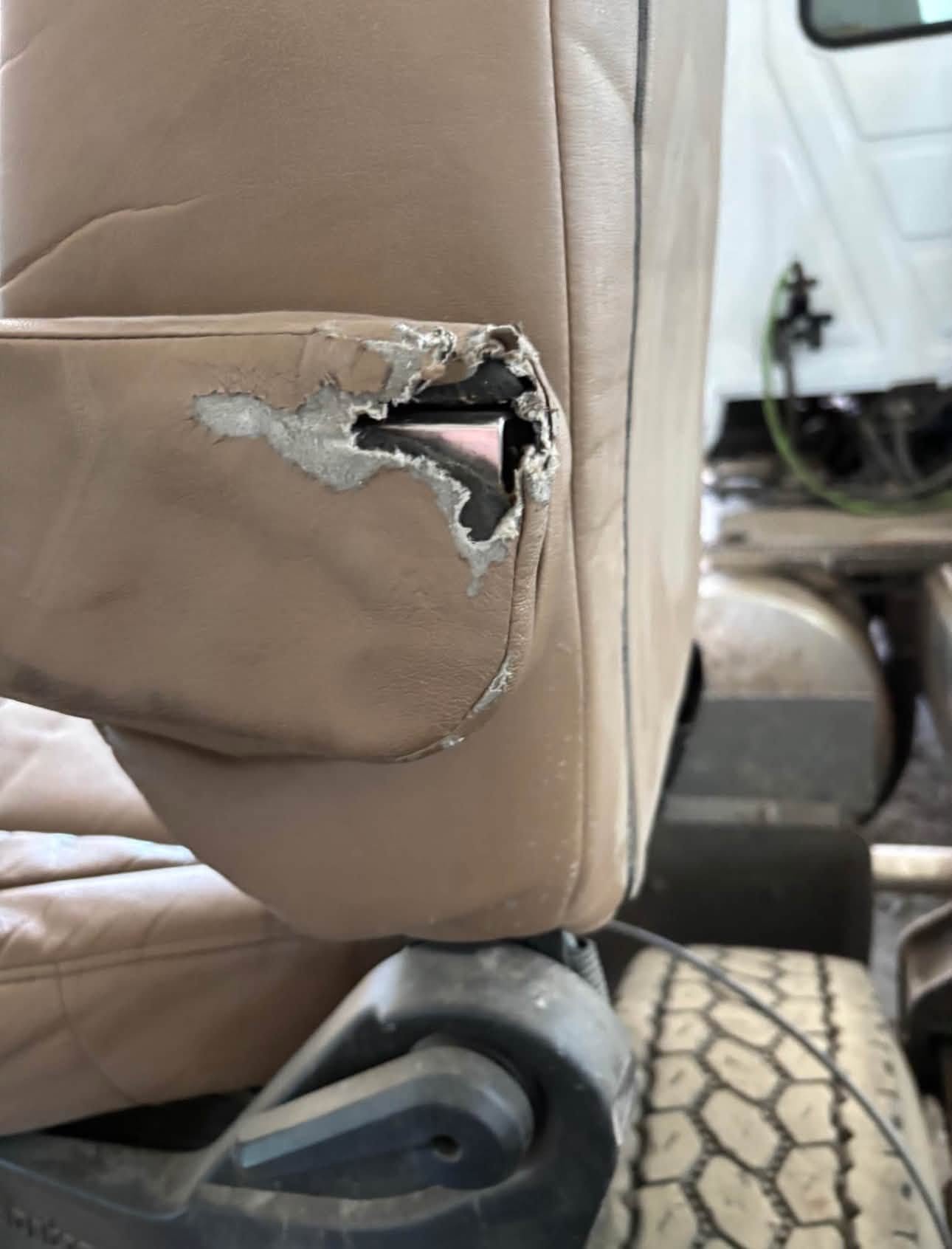 Bostrom Wide Ride seat, Bostrom air ride seat, Bostrom truck seat, Bostrom Wide Ride air seat, tan leather truck seat, truck air ride seat, used Bostrom seat, Bostrom seat for sale, used truck seat, replacement truck seat, semi truck air ride seat, heavy duty truck seat, commercial truck seat, Bostrom Wide Ride replacement seat, tan truck seat, air suspension truck seat.